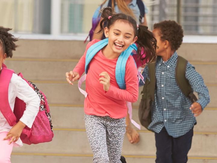 Children happily leaving school.