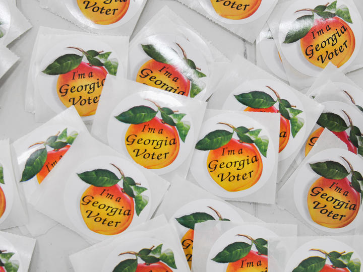 Round iconic I'm A Georgia Voter peach stickers.
