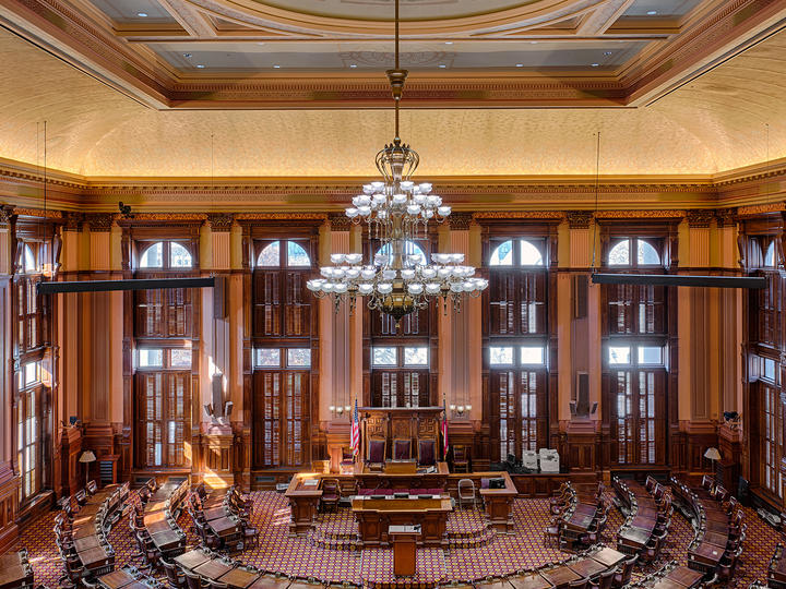 Overhead view of the Georgia House of Representatives with its ornate architecture and antique chandelier.