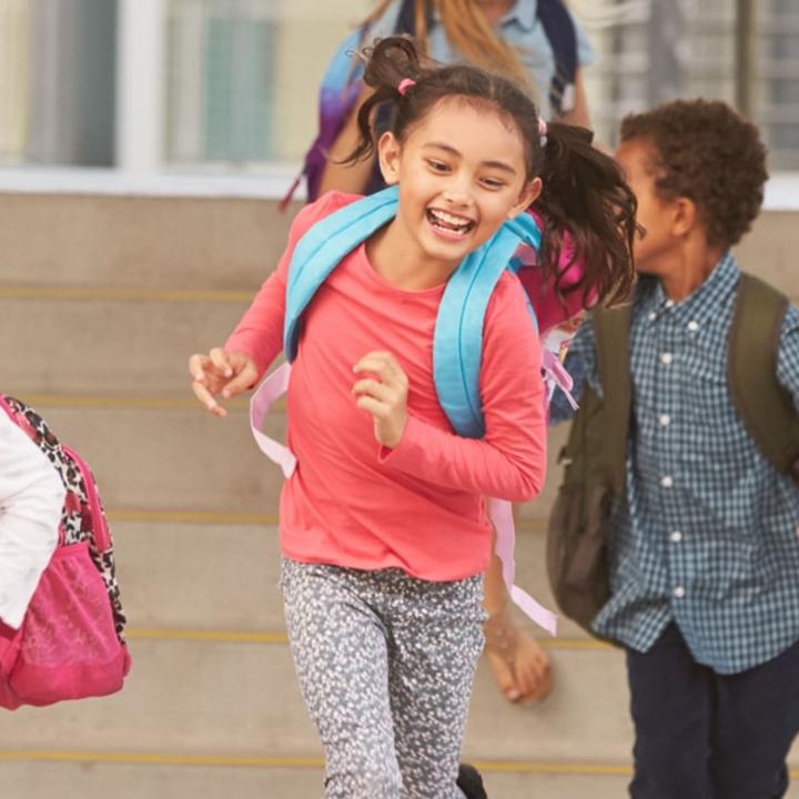 Children happily leaving school.