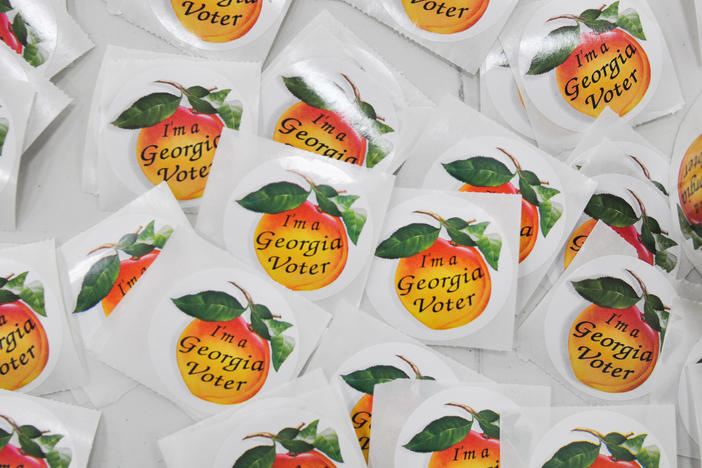 Round iconic I'm A Georgia Voter peach stickers.