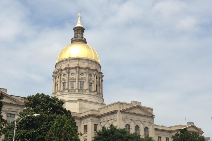 The Georgia capitol sits against the blue sky.